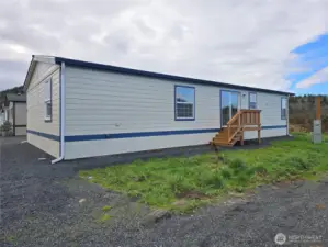Private back porch with yard space and scenic views over the neighboring farm. The Versatile yard space offers room to landscape, garden, or customize to your needs.