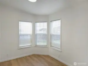 The corner windows bring in natural light and peaceful views.