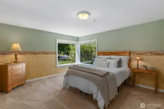 Primary bedroom with newer carpet and paint. Room is larger in person than appears in picture.