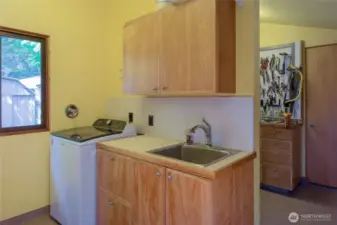 Laundry room has new washer and dryer.