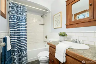 Primary full bathroom with custom touches throughout.