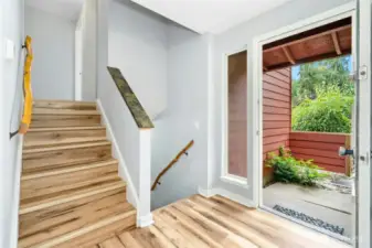 Stone accents integrated throughout the home, note the custom handrails