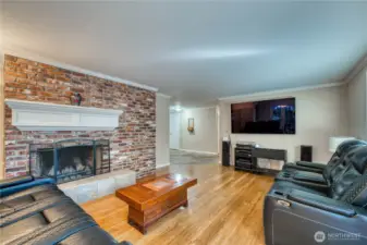 Living room with second wood burning fireplace