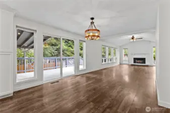 Dining area beside sliders that open to the covered deck.
