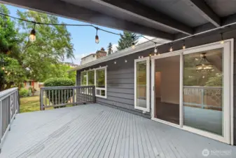 Deck outside sliders overlooking the level backyard.
