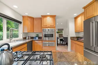 Spacious kitchen with stainless appliances.