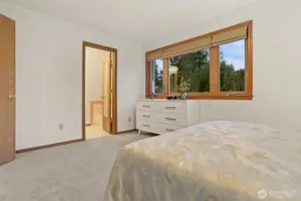 Primary bedroom looking to private 5-piece bath.