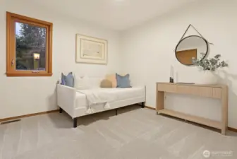 One of two large upper level bedrooms.