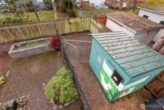 Raised ceramic garden bed, chicken coop, and protected chicken run.