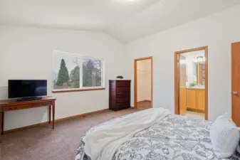 Light Filled Room with Walk-In Closet, Vaulted Ceilings and En-Suite Bathroom.