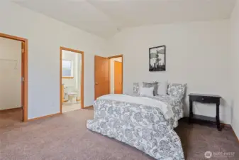 Light Filled Room with Walk-In Closet, Vaulted Ceilings and En-Suite Bathroom.