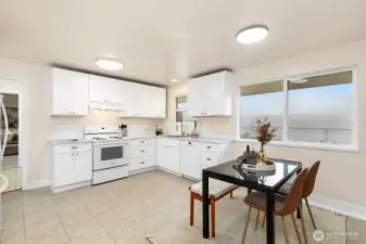 Bright kitchen with oversized window and plenty of natural light.