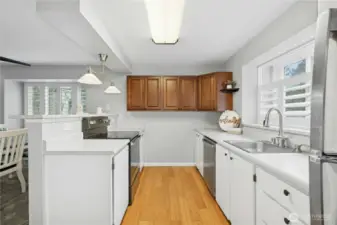 The open kitchen connects seamlessly to the dining area