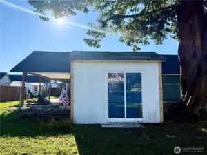 This little shed holds the washer and dryer plus work space and storage