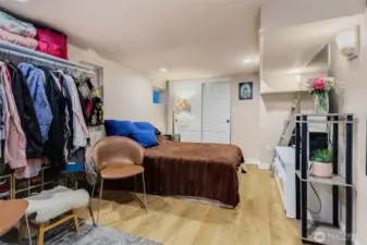 Downstairs family room and laundry (currently being used as a bedroom)