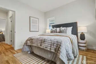 Bedroom 1 looking towards hall. Hardwoods!