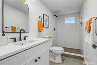 New common bathroom downstairs with designer tile