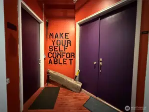 Two doors, studio on the left and apartment on the right.