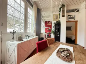 Tall windows facing East flood the unit with light