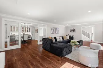 Great room with television mounted above the fireplace