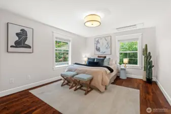 The second bedroom offers, beautiful private views of the backyard