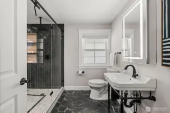 In the hallway, you'll find the most beautiful bathroom I've ever seen