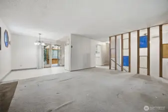 Looking across the living room toward the dining area and kitchen.