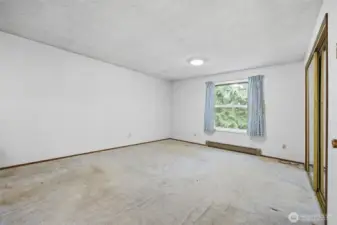 The primary bedroom is very large and looks to the front (east) of the property.