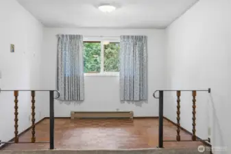 This is a lovely sitting or craft area that is west-facing and looks to the rear of the property.