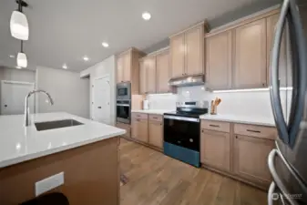 Quartz Slab Countertops in Kitchen and Bathrooms, Stainless Appliances w/ Wall Oven, Full Height 3×6 Subway Style backsplash