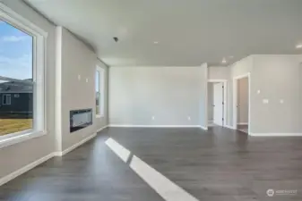 Linear Style fireplace in the Great Room, Laminate Plank Flooring throughout open living areas