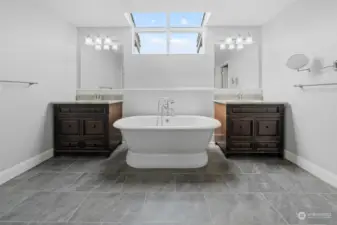 5-piece bath with contemporary ceramic flooring, standalone tub and granite counters.