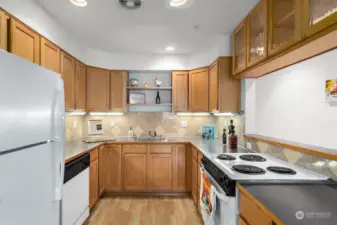 U-shaped Kitchen is quite large!   Plenty of wood cabinetry and tons of counterspace make this kitchen a wonderful place to prepare meals.