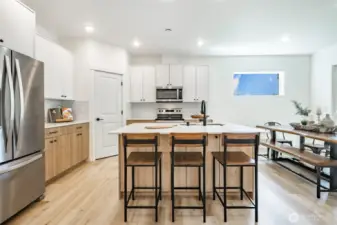 Photos shown are of a similar floor plan previously built in a different neighborhood (The Ridge in Blaine). Finishes and features may vary. Some items pictured reflect buyer-selected upgrades which are not included in the base price and may be added at an additional cost.