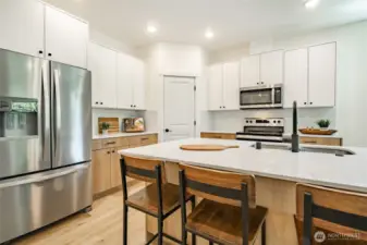 Photos shown are of a similar floor plan previously built in a different neighborhood (The Ridge in Blaine). Finishes and features may vary. Some items pictured reflect buyer-selected upgrades which are not included in the base price and may be added at an additional cost.