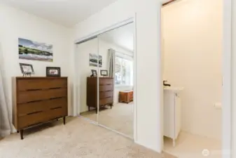 The primary bedroom features a half bath