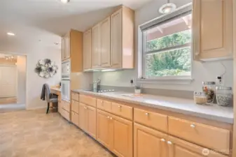 Kitchen has lots of prep area and cabinet space. And abundant natural light!
