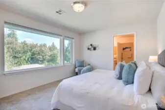 Wake up to amazing views each morning in your primary bedroom suite.