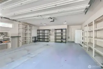 2-car garage. Shelving included. Also extra office/shop area.