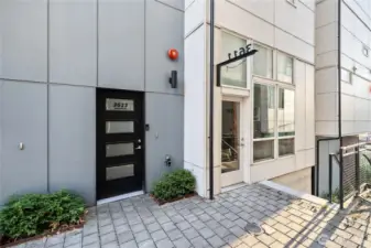 Separate entry for commercial space (plus adjoining interior door) with hanging sign that can be seen from both sides of the plaza