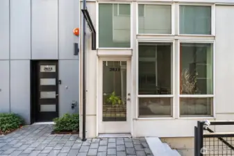 Separate entry for commercial space (plus adjoining interior door) with hanging sign that can be seen from both sides of the plaza