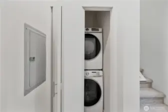 Hallway laundry  next to secondary bedroom