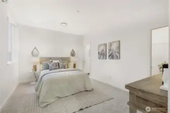 Primary bedroom with  en suite bathroom and walk-in closet. Views of Fremont canal from bedroom window. Each bedroom has heatpump cooling & heating