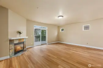 Pretty tile surround and mantel adds to the ambience of the great room.  Lovely new LPV flooring is a neutral color sure to go with any decor.  Easy to keep looking clean too!