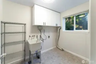 Laundry room with attached half bath