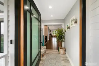 Formal entry with custom pivot door. $15,000.