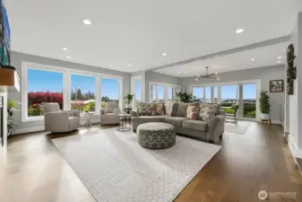 Glorious living room with 52" Montigo Phenom 2-sided see-through gas fireplace and views from every window allowing all year natural light.