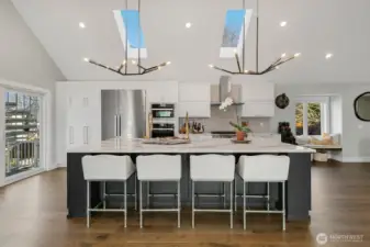 Custom Bellmont Cabinetry. Electronic touch-to-open overhead cabinets. Two large pantry cabinets with pullout drawers.