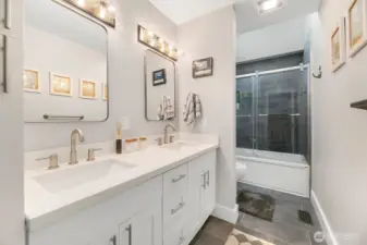 Almost never used full bathroom upstairs near the three bedrooms, separate from the upstairs primary suite. A large landing divides the areas.