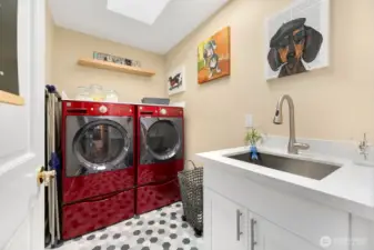 Upper level laundry room with extra deep sink.